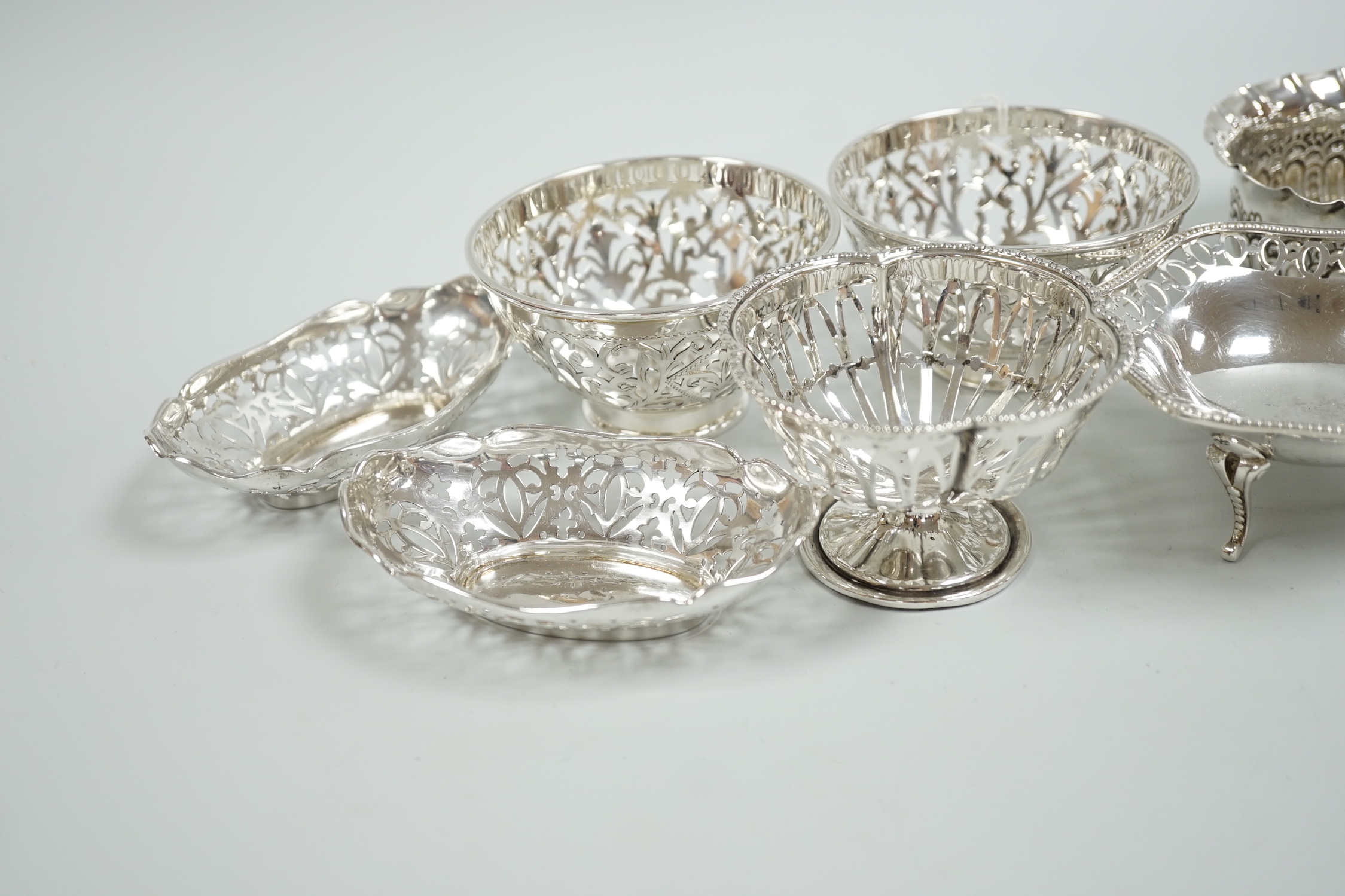 A modern pair of pierced silver sweetmeat bowls, by C.J. Vander Ltd, diameter 84mm, a pair of earlier bonbon dishes and four other silver bowls, 15.9oz.